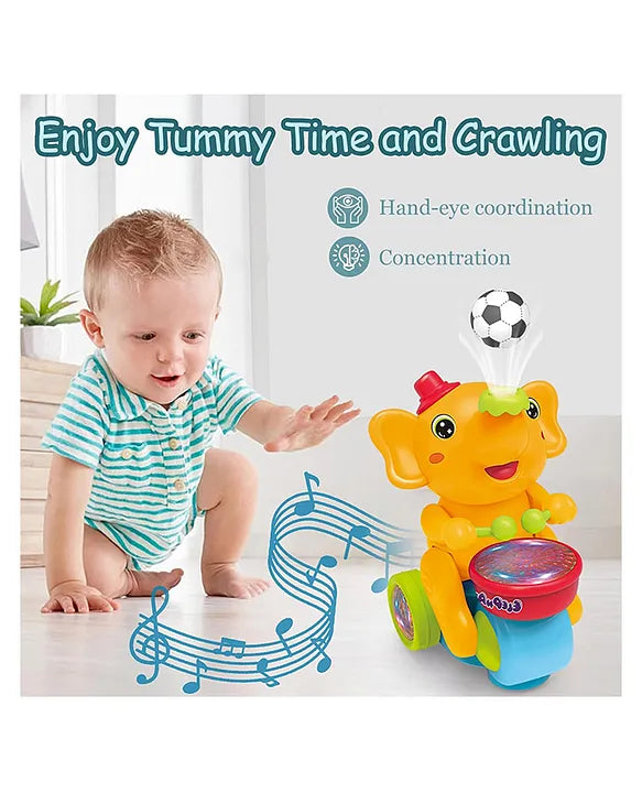 Baby playing with a colorful elephant toy on a light background