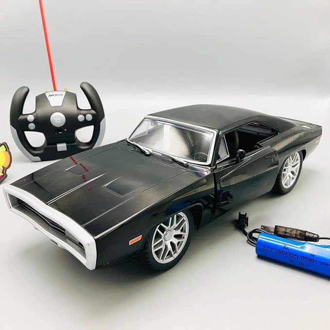 Model car with remote control and battery on a white background